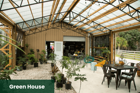 Charming greenhouse event space perfect for hosting unique birthday celebrations, intimate parties, and unforgettable events surrounded by lush greenery and rustic decor.